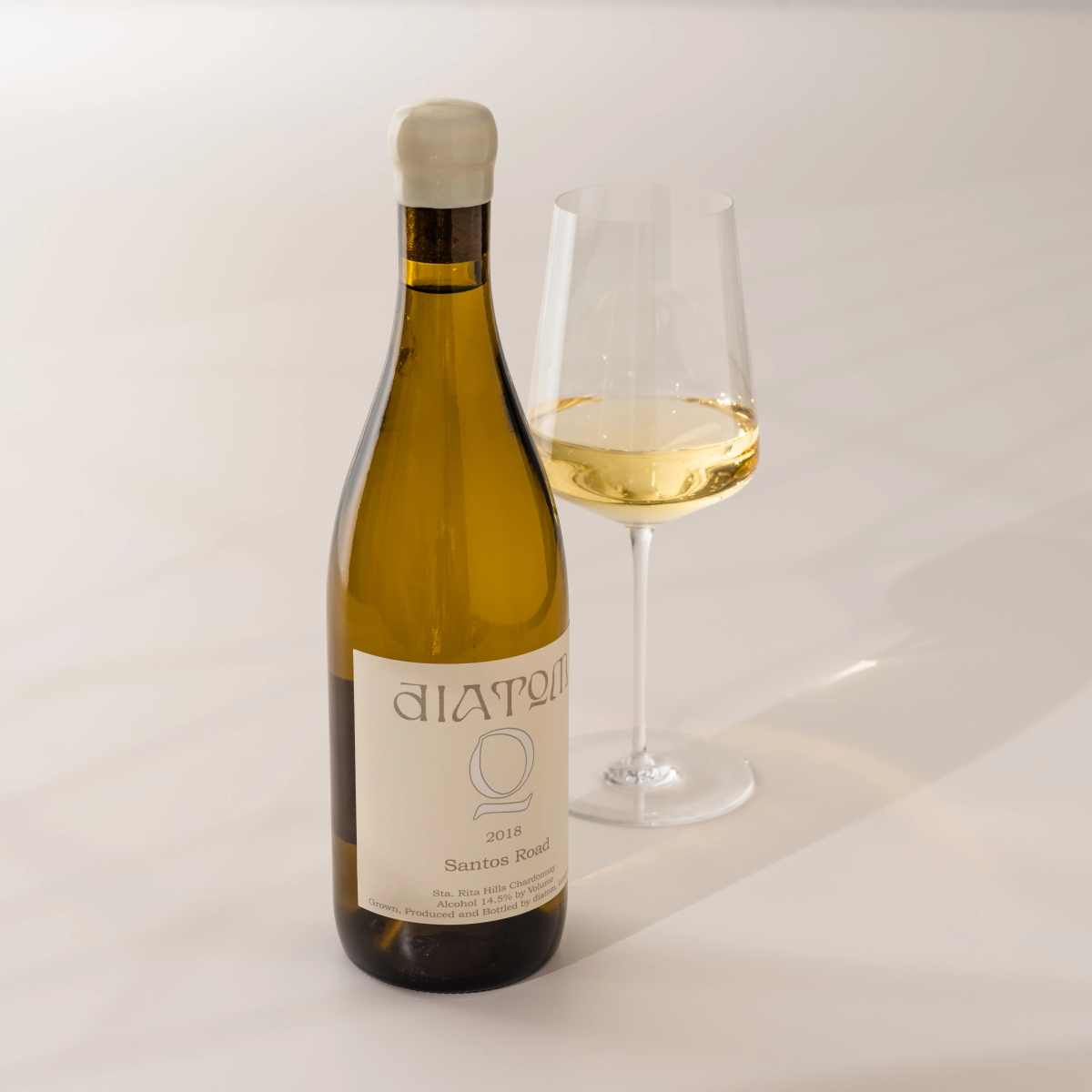White wine bottle with glass of wine