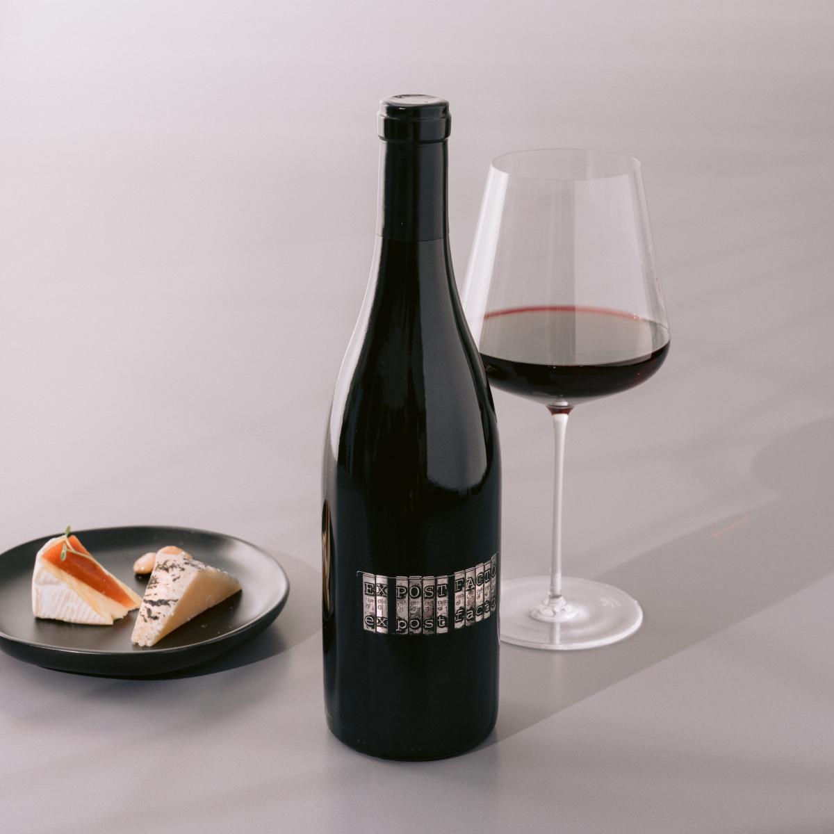 Syrah red wine bottle and cheese 