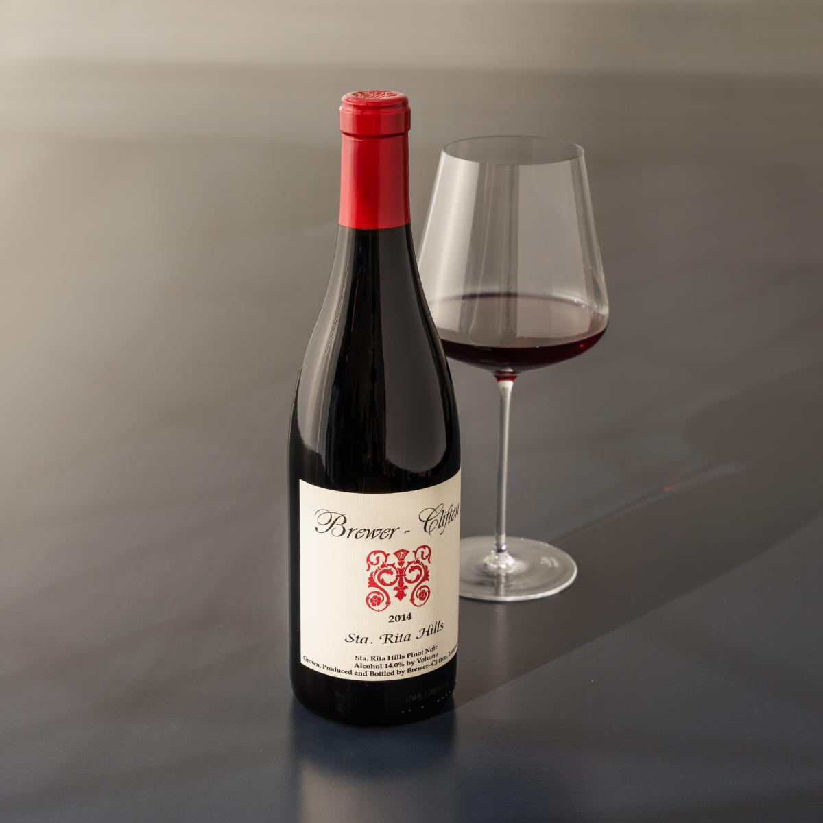Pinot Noir red wine bottle and wine glass 
