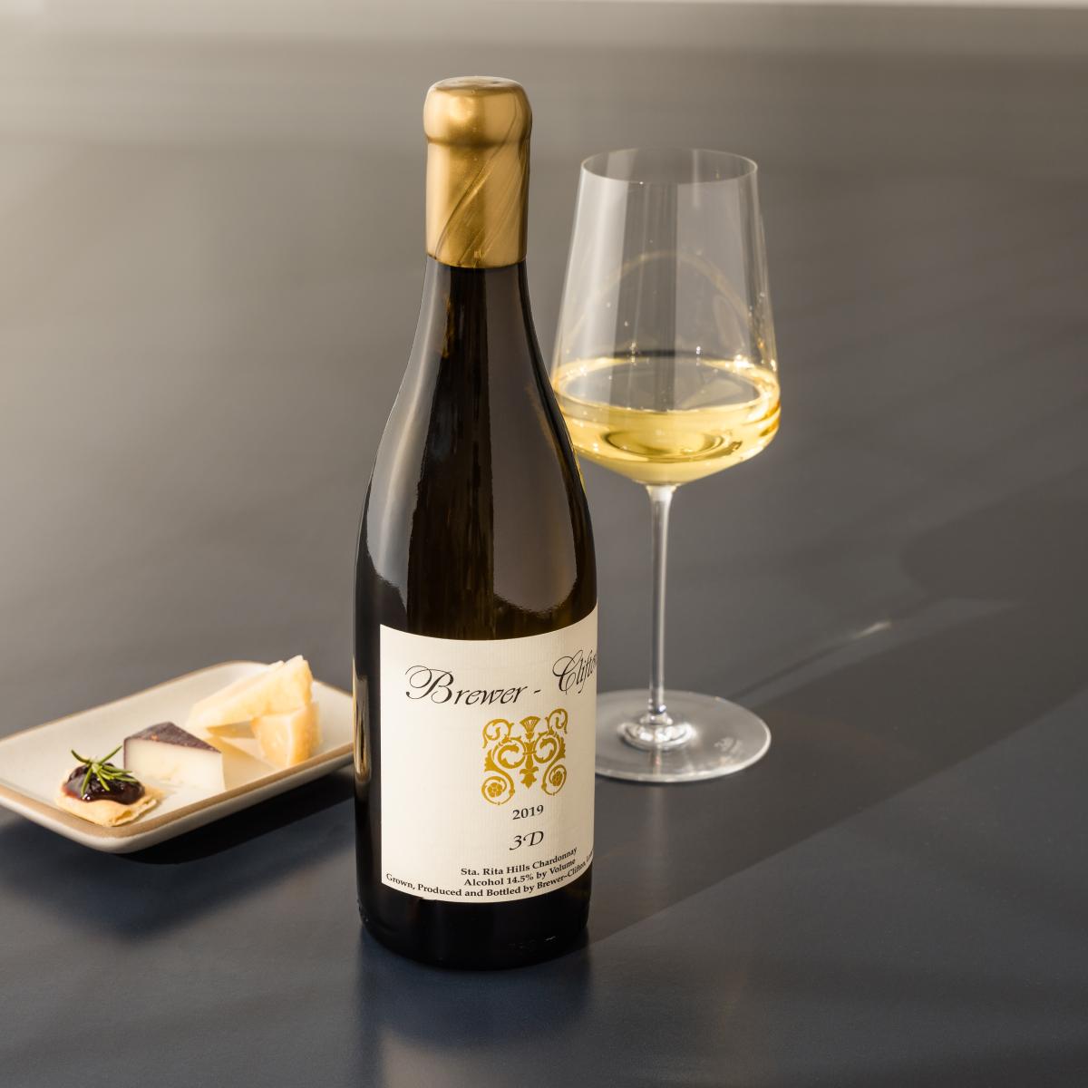 3D Chardonnay bottle shot with wine glass and cheese 