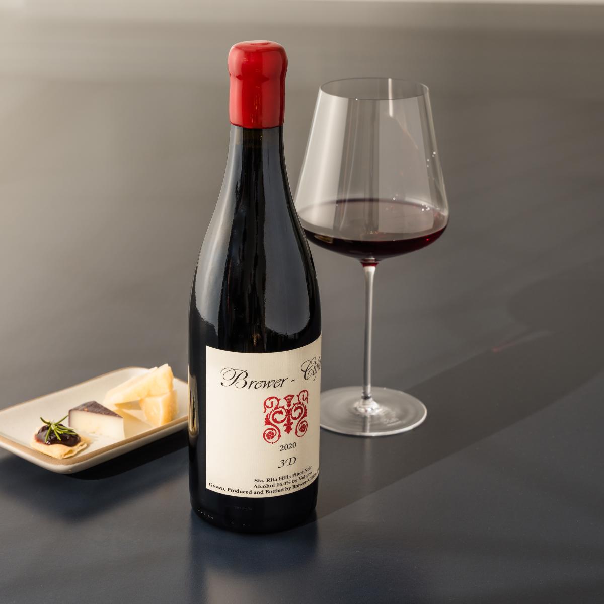 3D Pinot Noir side bottle shot with wine glass and cheese 