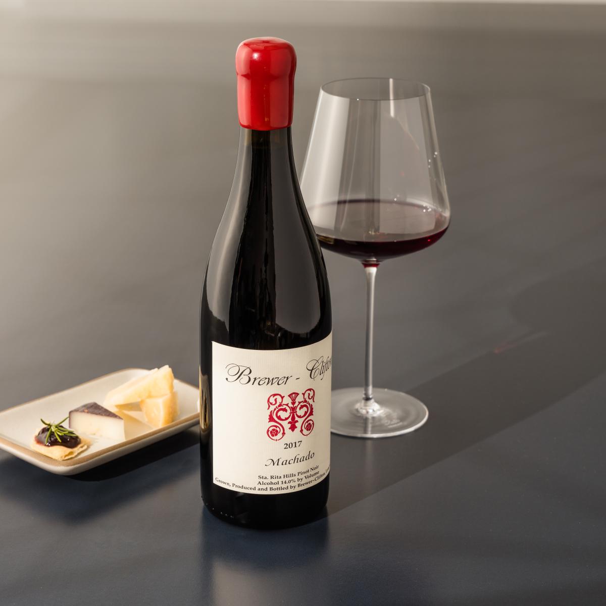 Brewer-Clifton Machado Pinot Noir 2017 with wine glass and cheese 