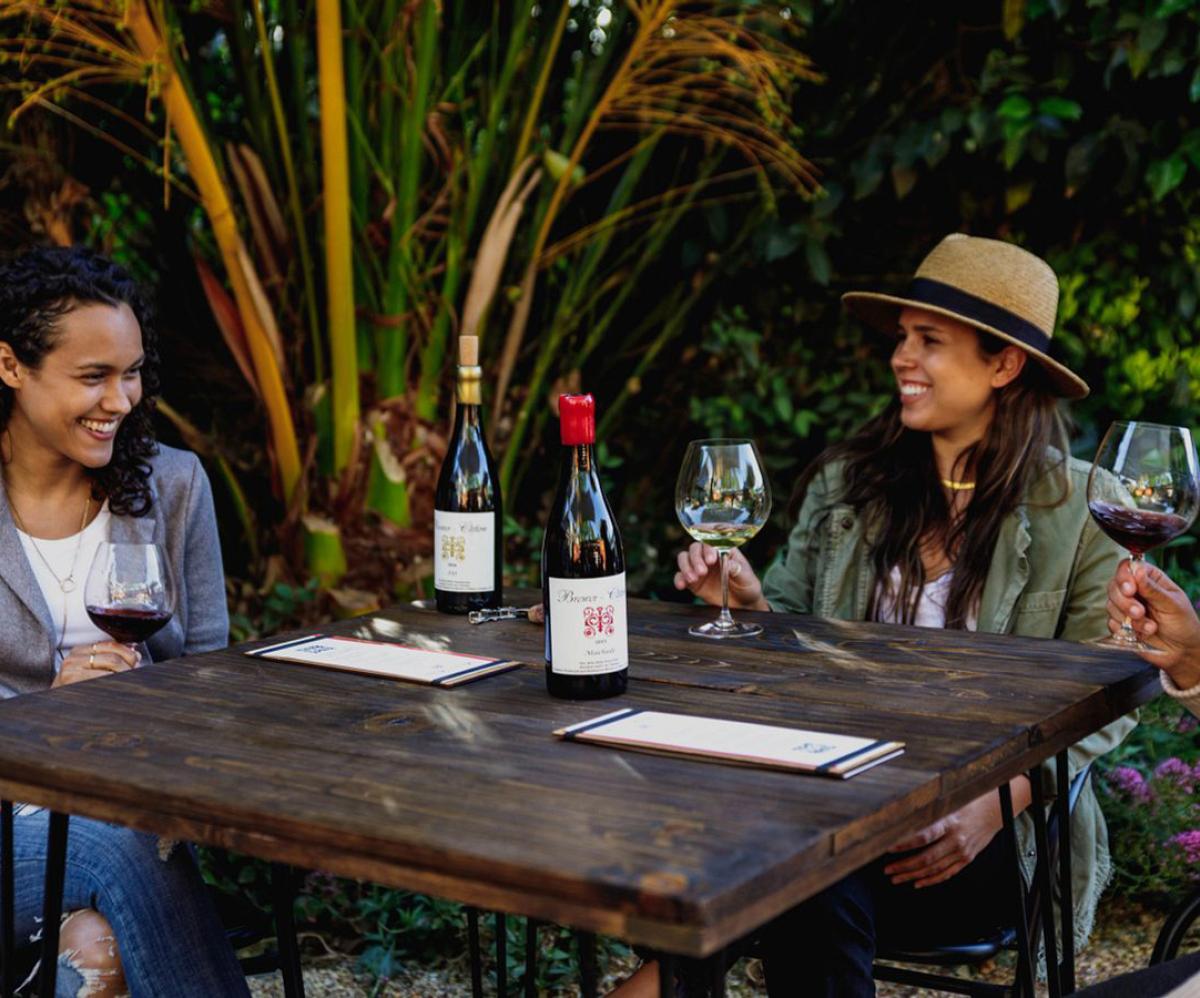 Women enjoying Brewer-Clifton wines at Los Olivos tasting room