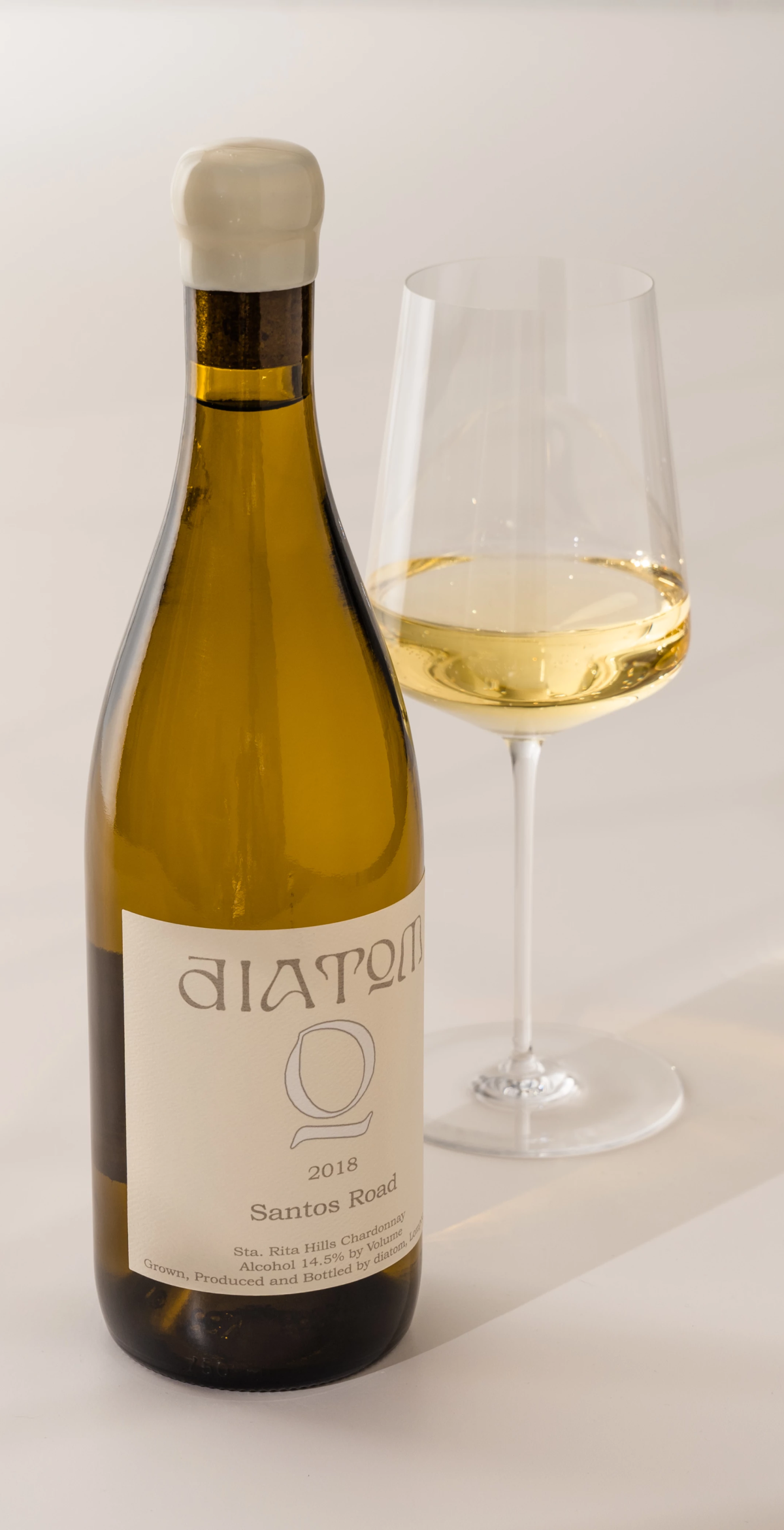 White wine bottle with glass of wine