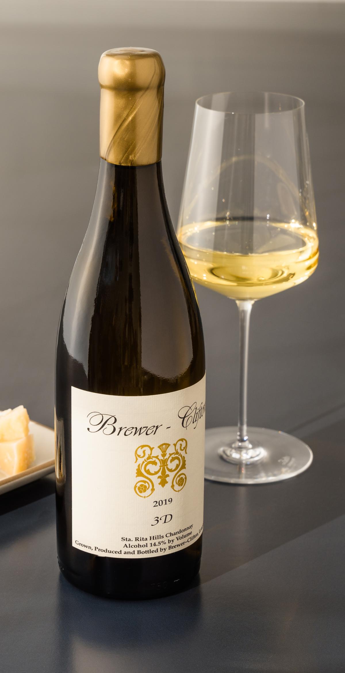 3D Chardonnay bottle shot with wine glass and cheese 