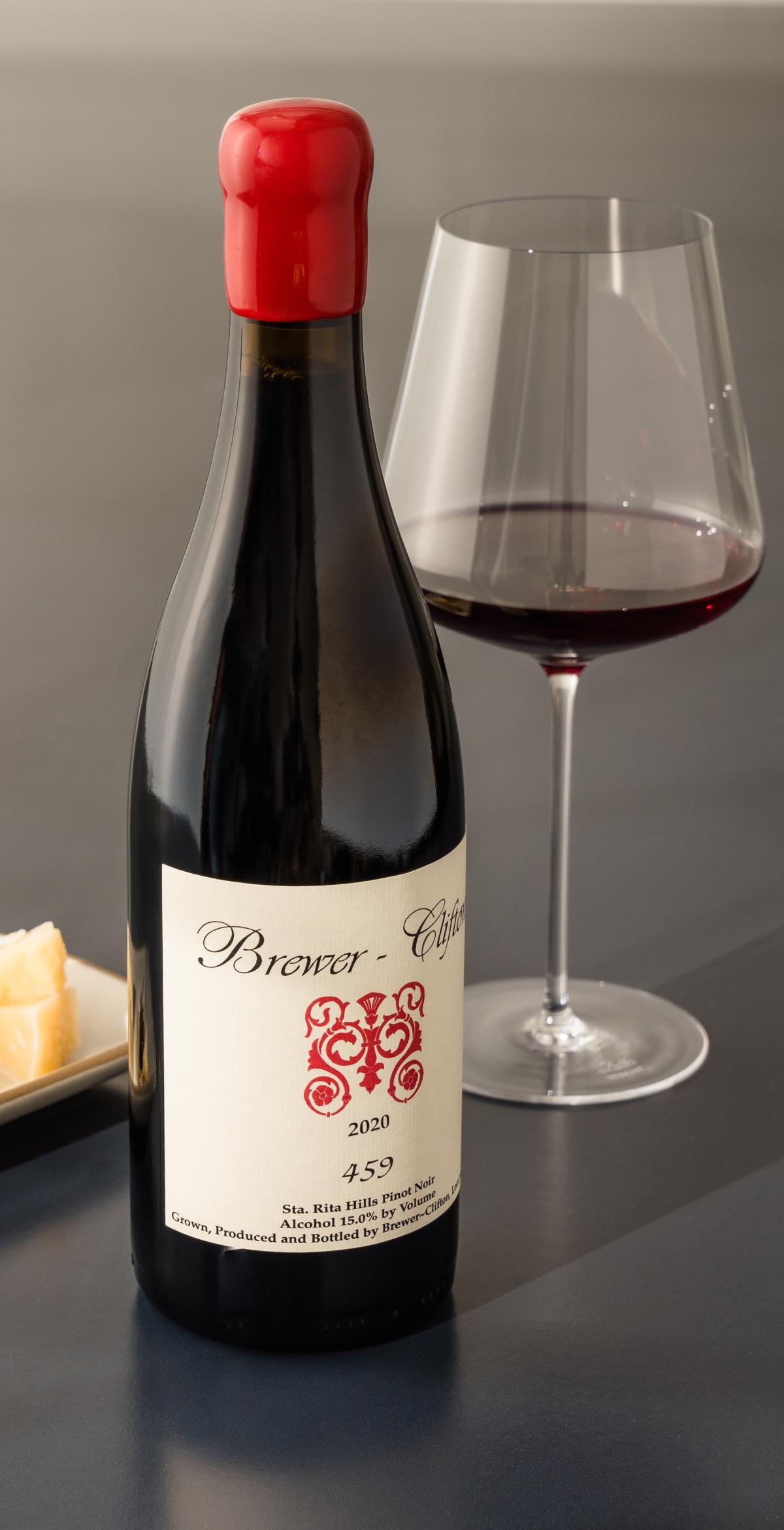 459 Pinot Noir side bottle shot with wine glass and cheese 