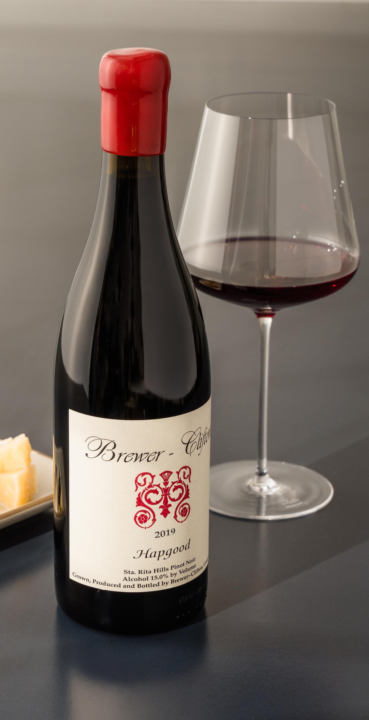Hapgood 2019 Pinot Noir bottle shot with wine glass and cheese 