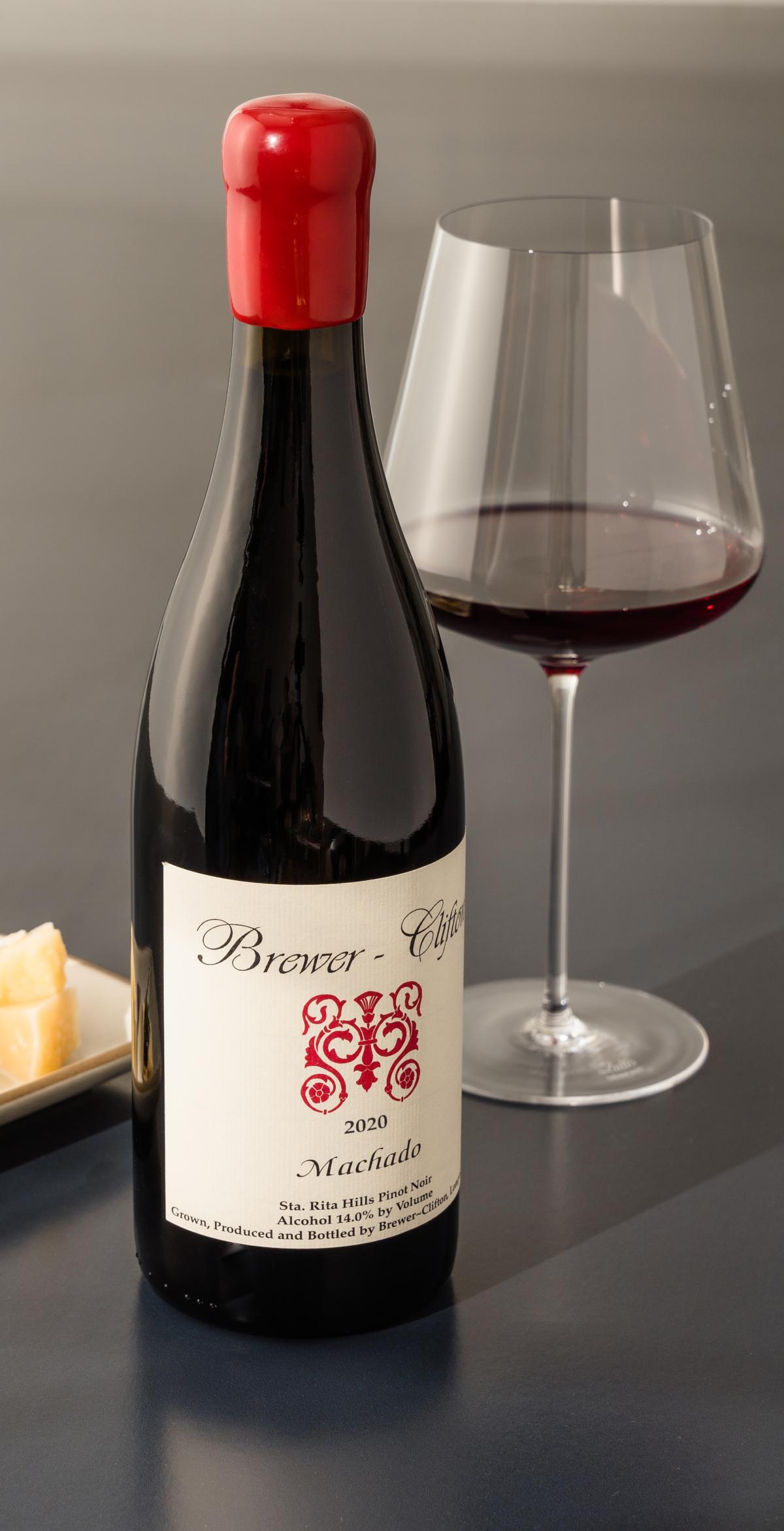 side Machado Pinot Noir bottle shot with wine glass and cheese 