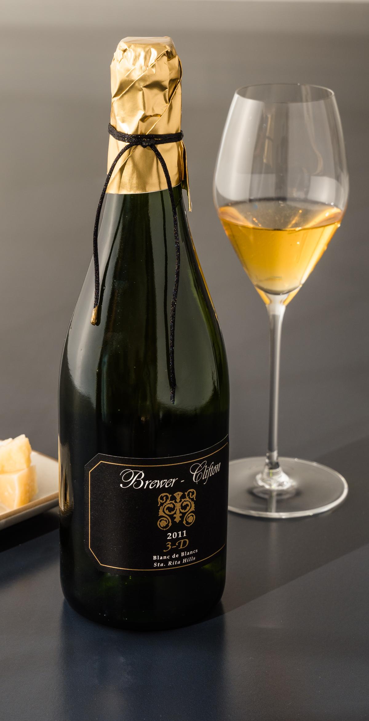 Sparkling Blanc de Blancs with wine glass and cheese 