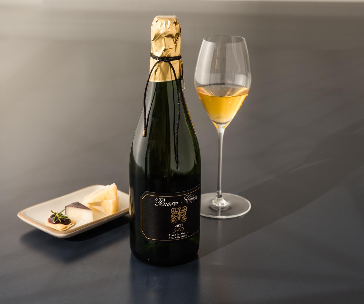 sparkling wine bottle and cheese