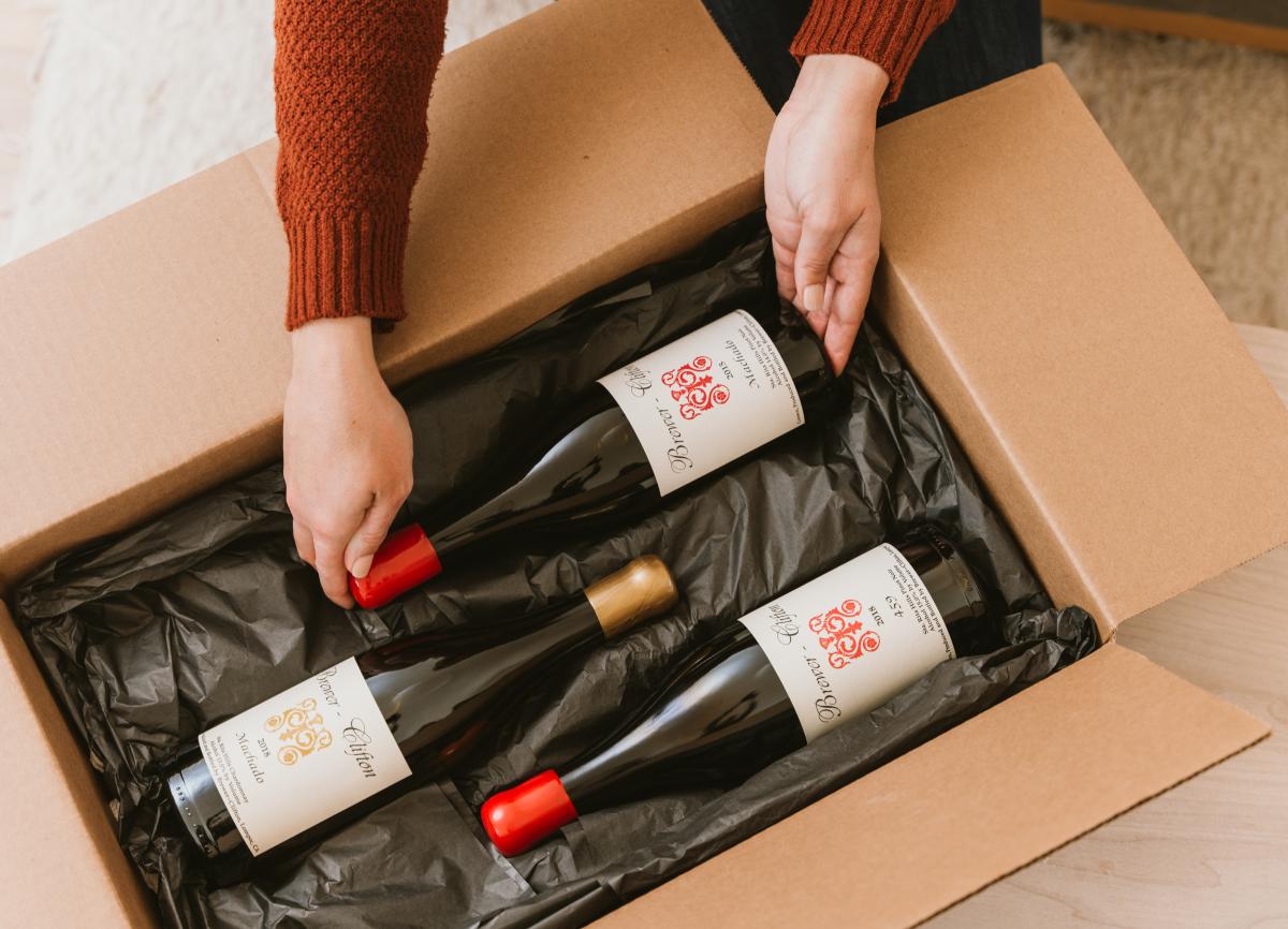 opening box of three bottles of wine